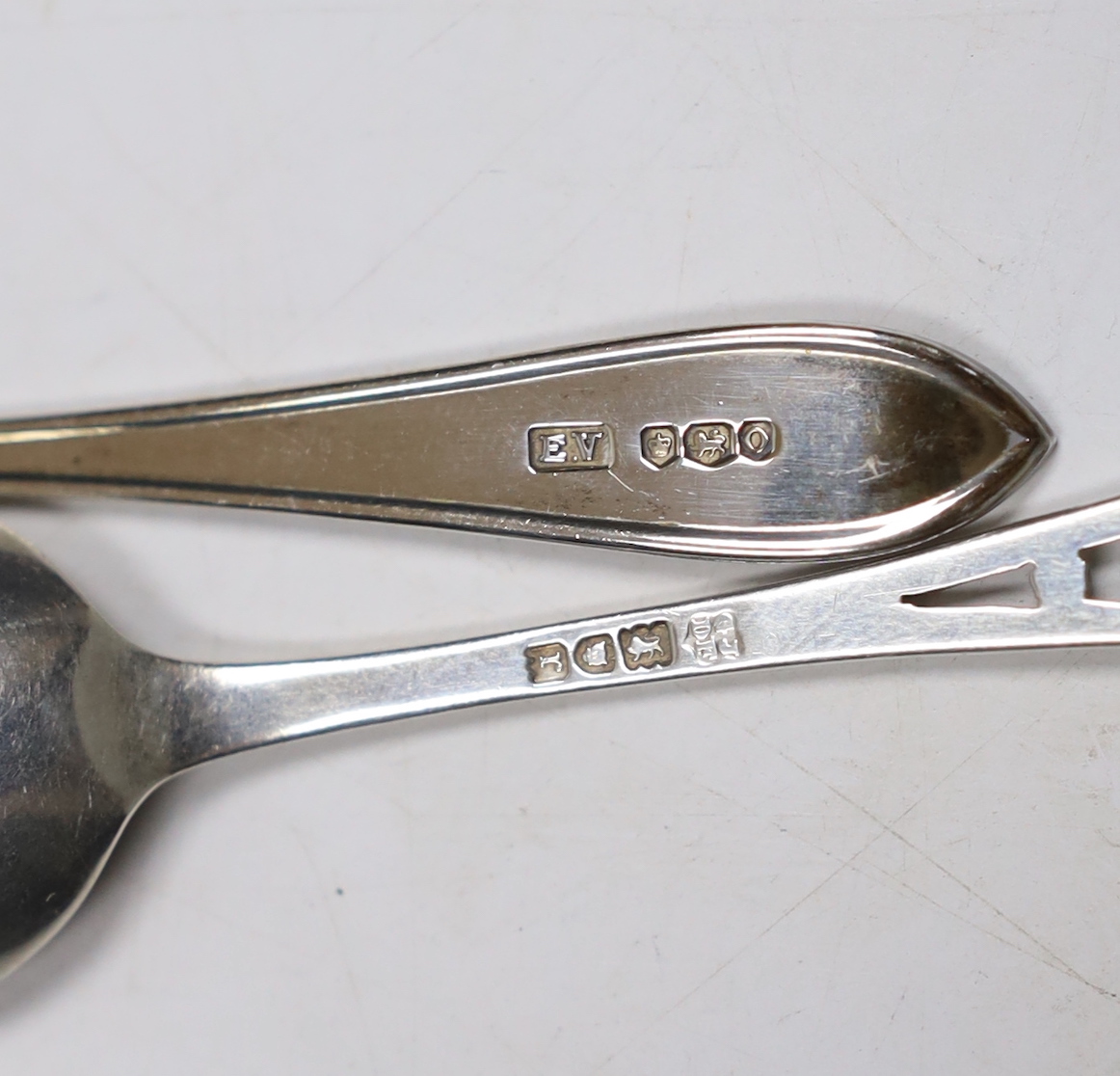 A set of twelve George V silver coffee spoons, with pierced handles, Josiah Williams & Co, London, 1912, 11.5cm, seven other silver spoons, a plated spoon and a three piece stag horn handled carving set.